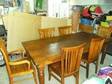 TABLE AND 6 chairs Large hardwood solid table together....